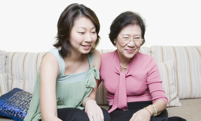 two women learning from their laptop at home