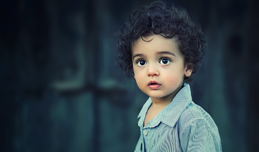 a girl with a cleft palate looking at the camera