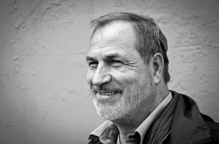 black and white picture of a man with a cochlear implant