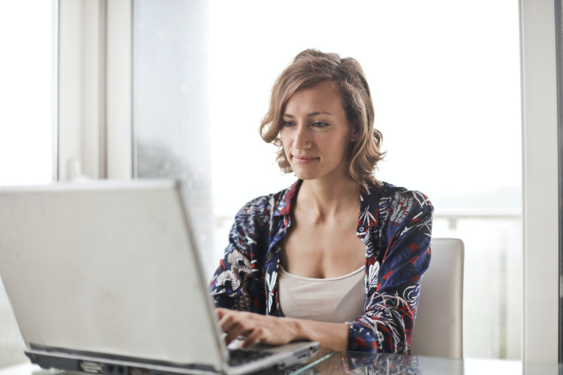 woman with a tremor at home on her computer