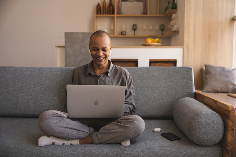 man learning from his laptop at home